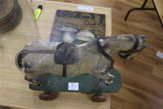 A Victorian painted carved wood pull-along horse